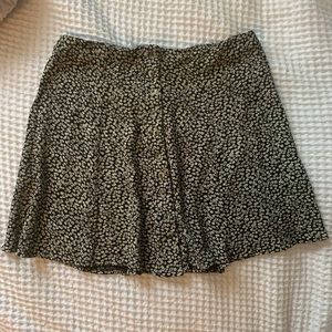 Black daisy mini skirt